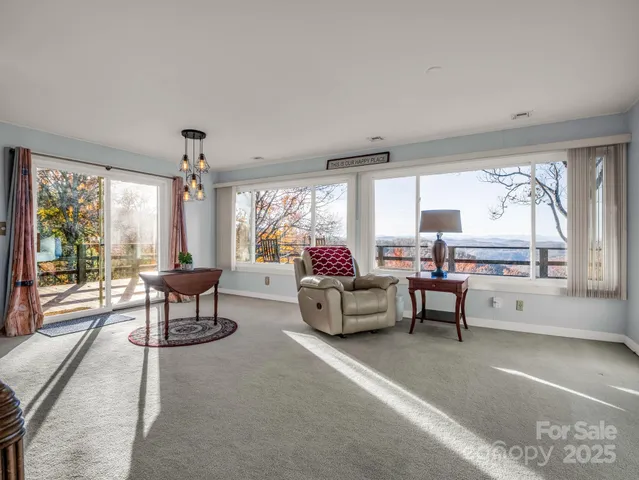 a kitchen with granite countertop wooden cabinets stainless steel appliances a sink and a window