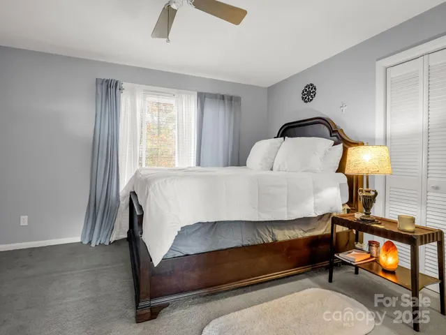 a view of an empty room and closet area