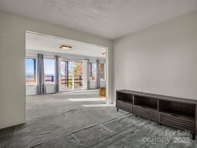 a room with a table and a flat screen tv