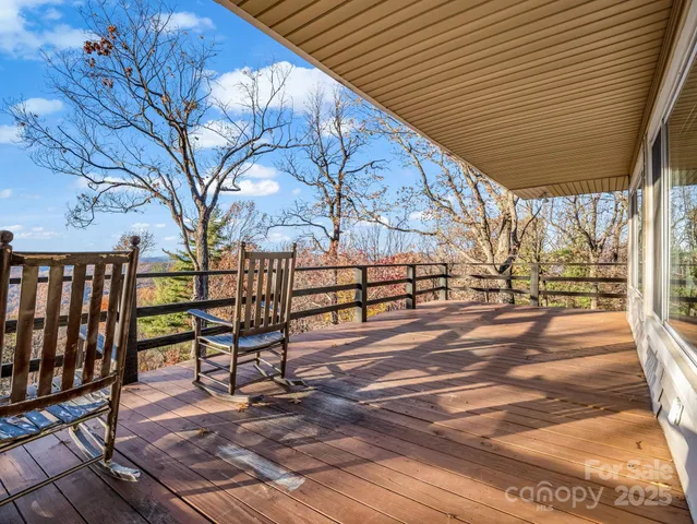 a dining room with furniture a chandelier and window
