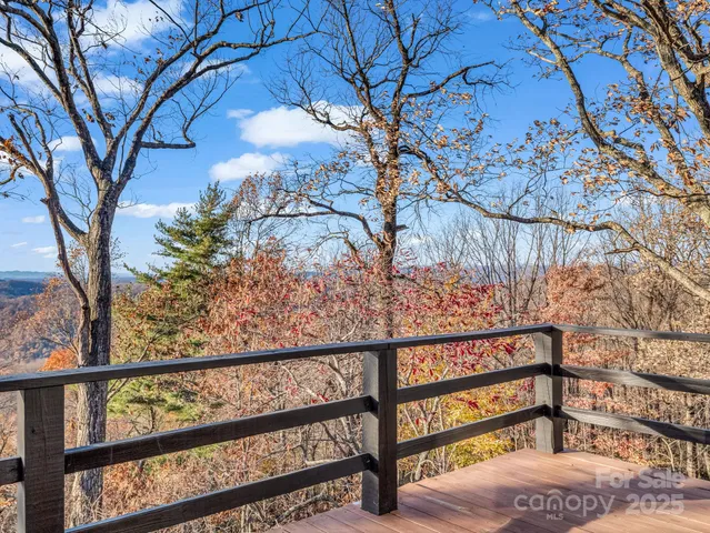 a kitchen with stainless steel appliances granite countertop a sink a stove and refrigerator