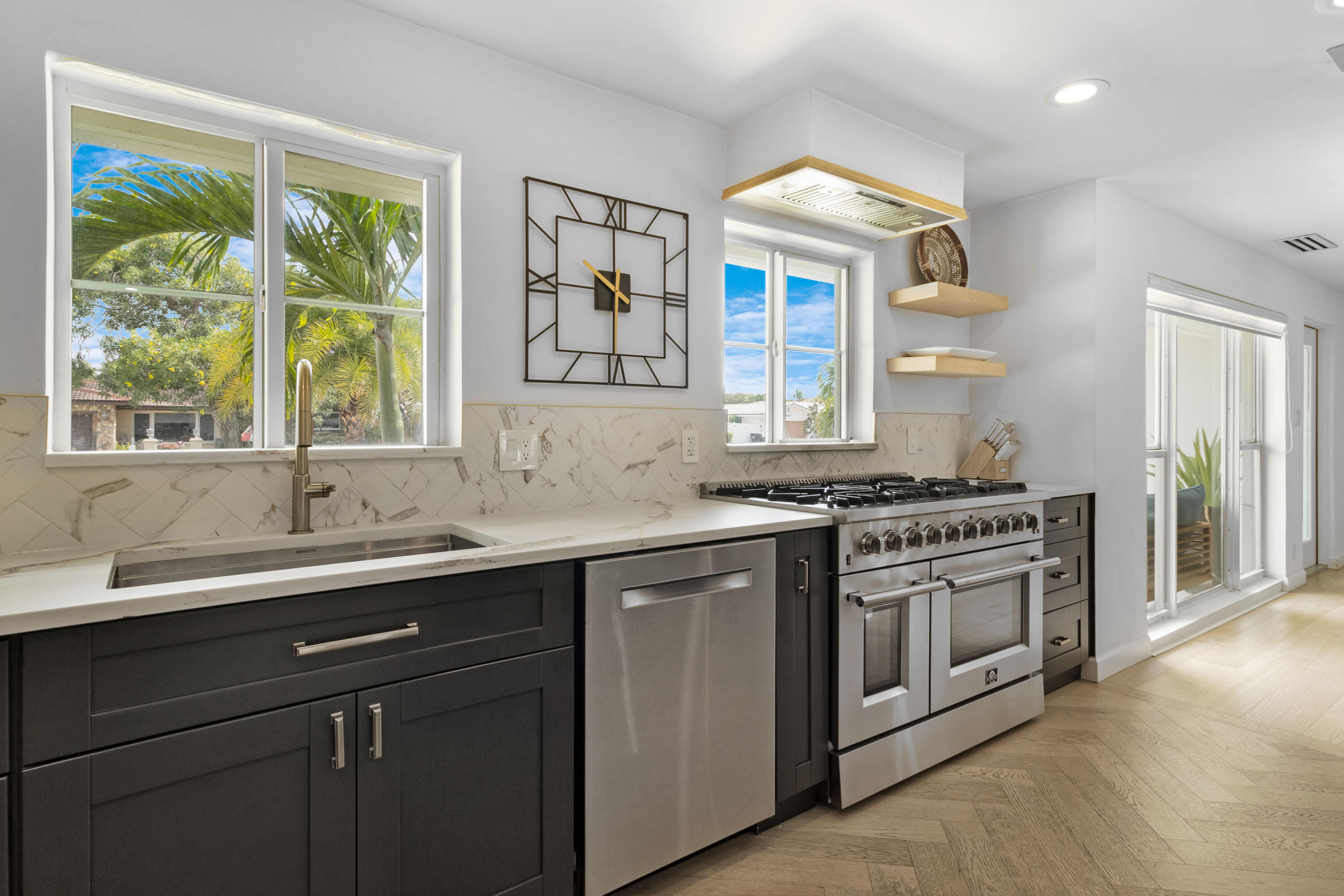 2862 Northeast 35th Court Lighthouse Point, FL 33064 - Photo 2 of 42 a kitchen with a sink and a window