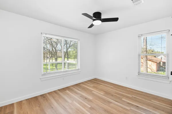 a view of empty room with windows