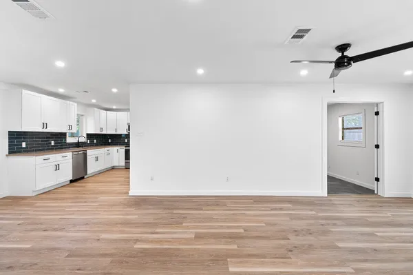 a view of kitchen with wooden floor
