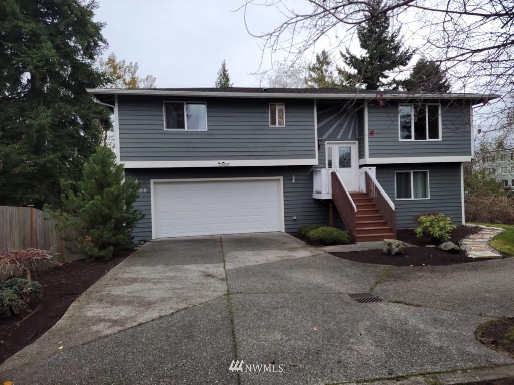 4606 Wood Place Everett, WA 98203 - Photo 1 of 37 a front view of a house with garage