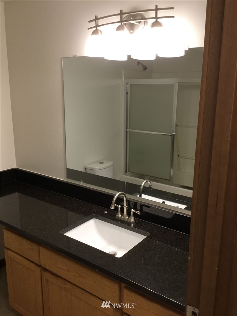 4606 Wood Place Everett, WA 98203 - Photo 20 of 37 a bathroom with a sink and a mirror