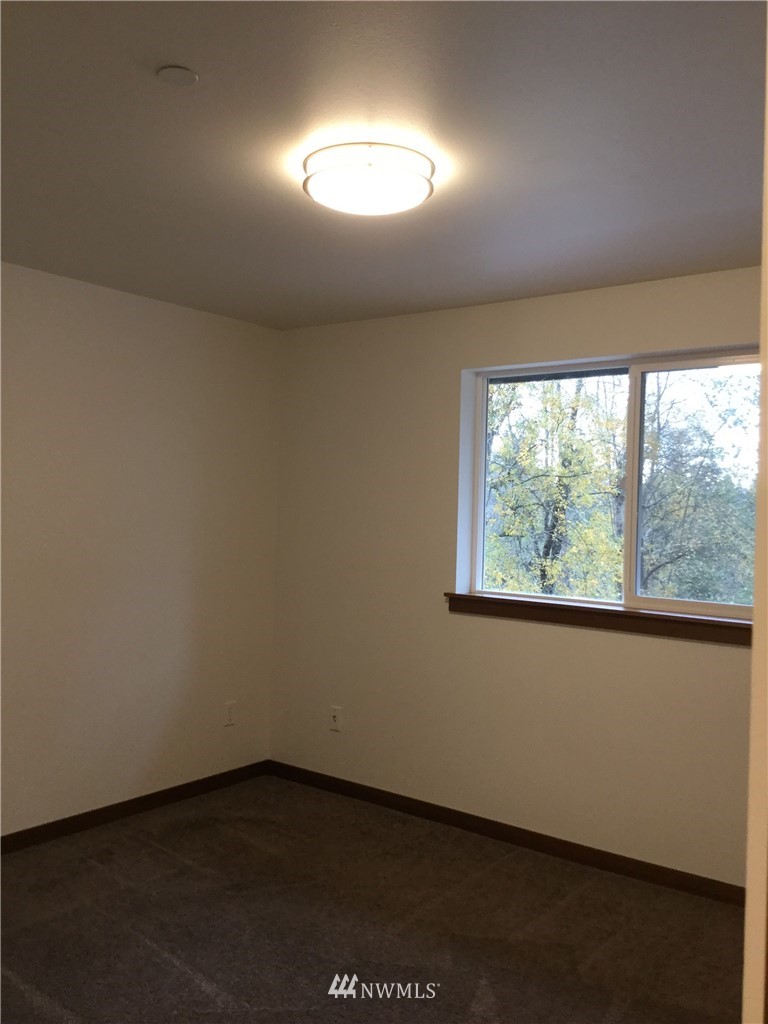 4606 Wood Place Everett, WA 98203 - Photo 23 of 37 an empty room with a window