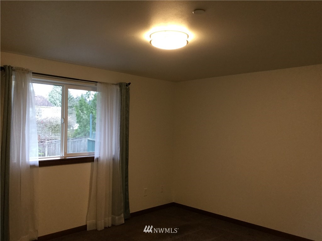 4606 Wood Place Everett, WA 98203 - Photo 26 of 37 a view of an empty room with a window