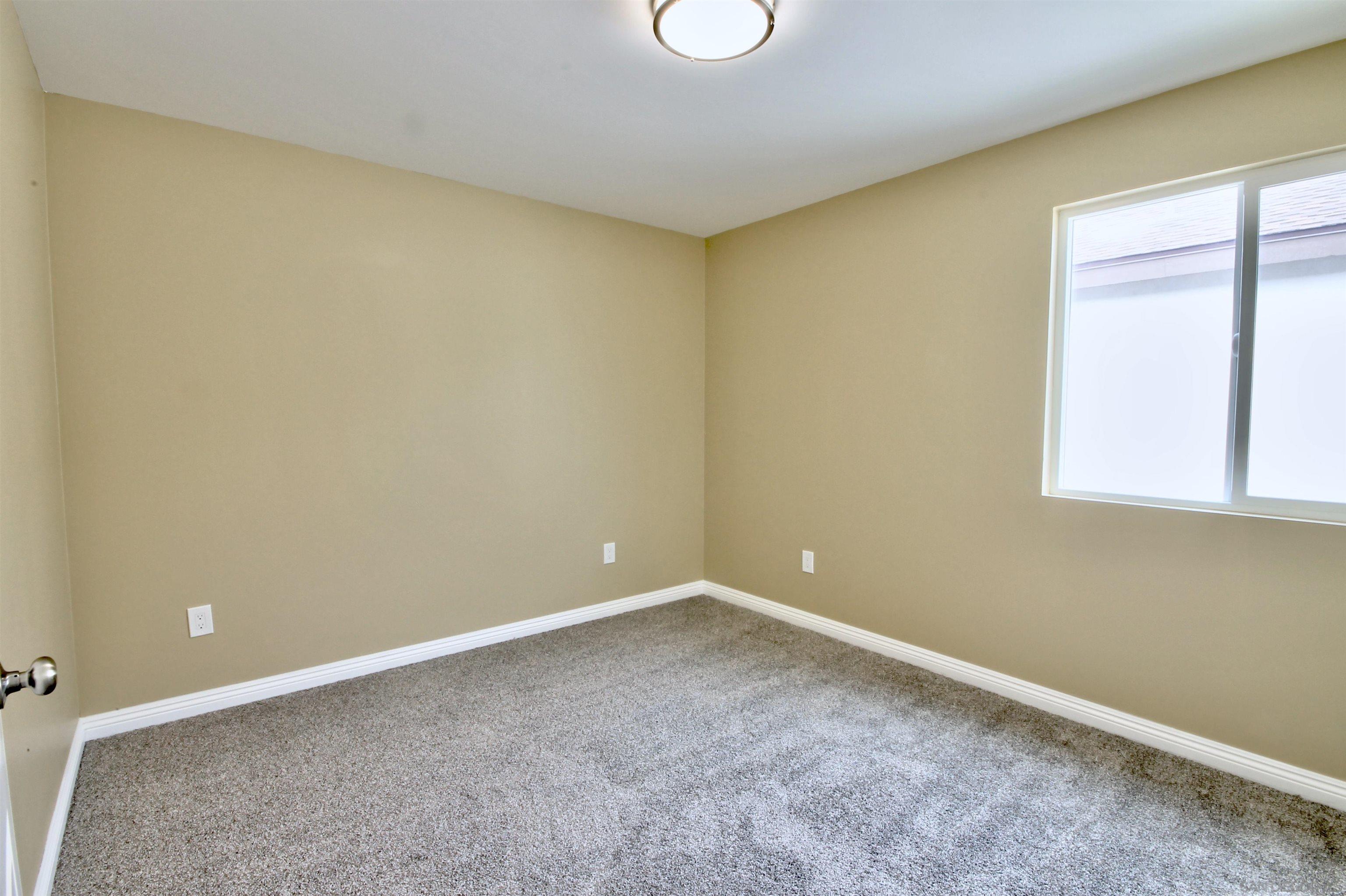 903 Concepcion Avenue Spring Valley, CA 91977 - Photo 12 of 41 an empty room with a window