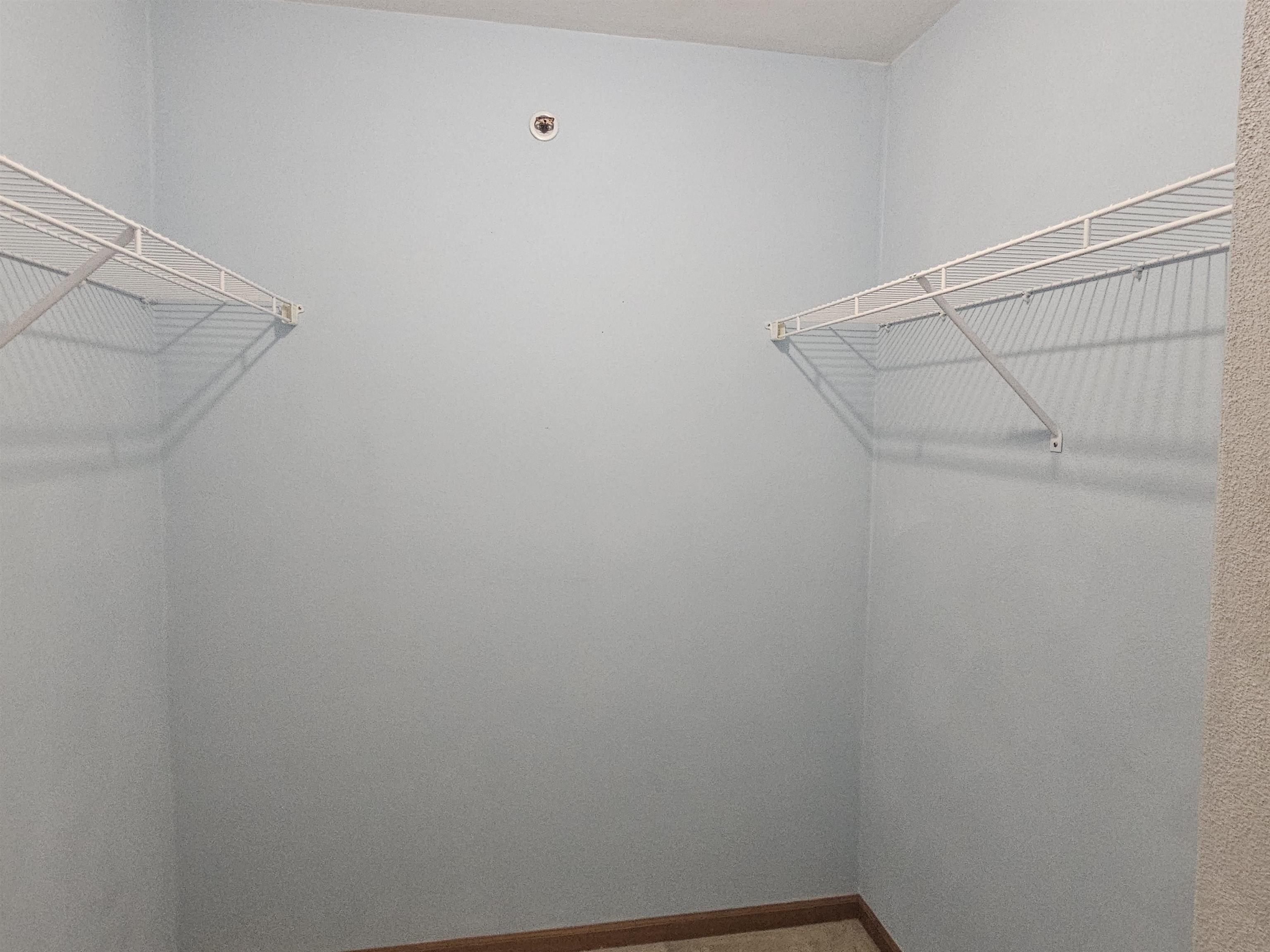 10167 Monarch Road Roscoe, IL 61073 - Photo 13 of 23 a view of a room with racks on the wall