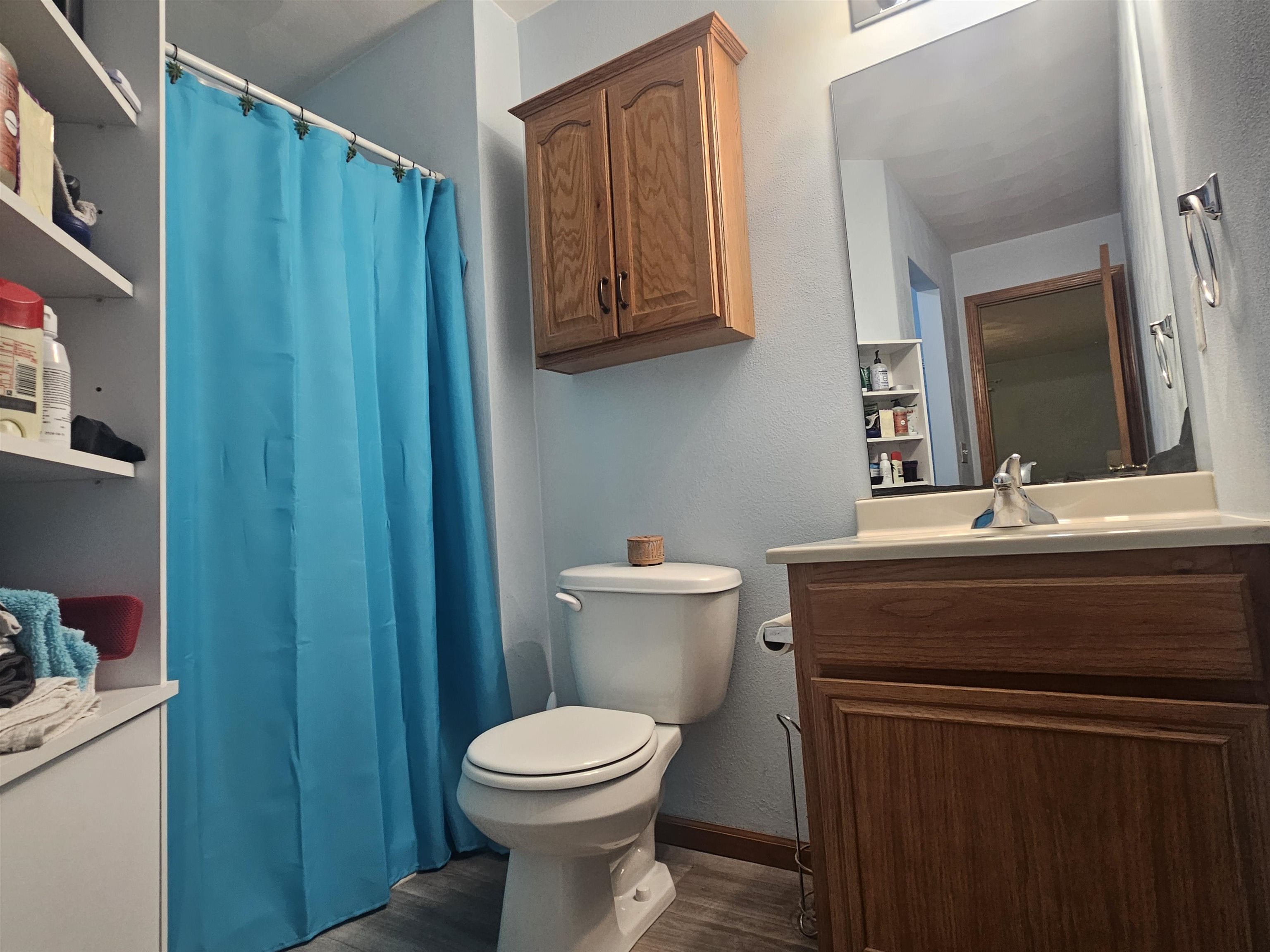 10167 Monarch Road Roscoe, IL 61073 - Photo 14 of 23 a bathroom with a toilet a sink and mirror