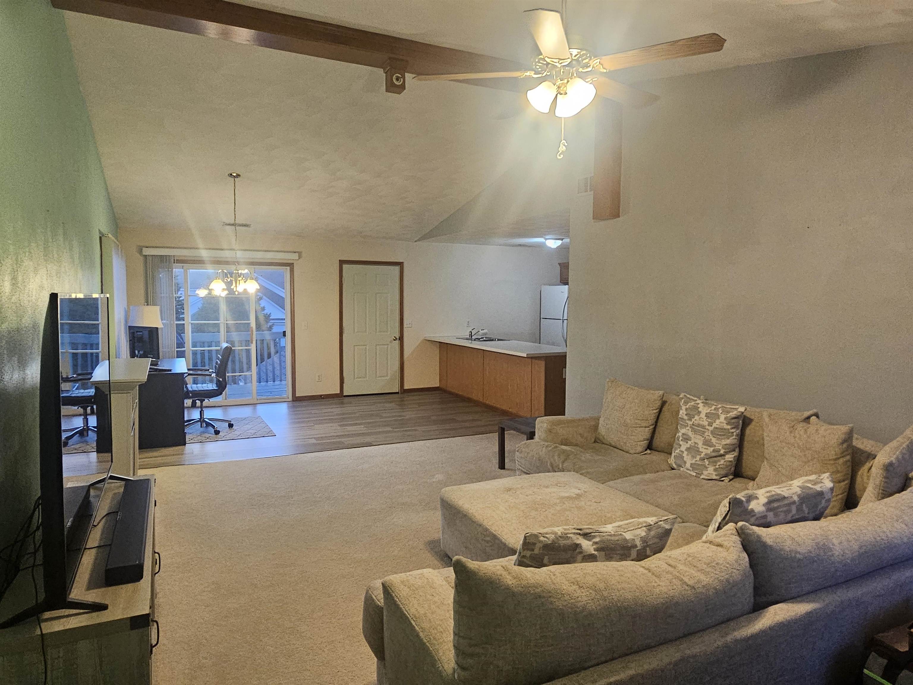 10167 Monarch Road Roscoe, IL 61073 - Photo 5 of 23 a living room with furniture and a flat screen tv