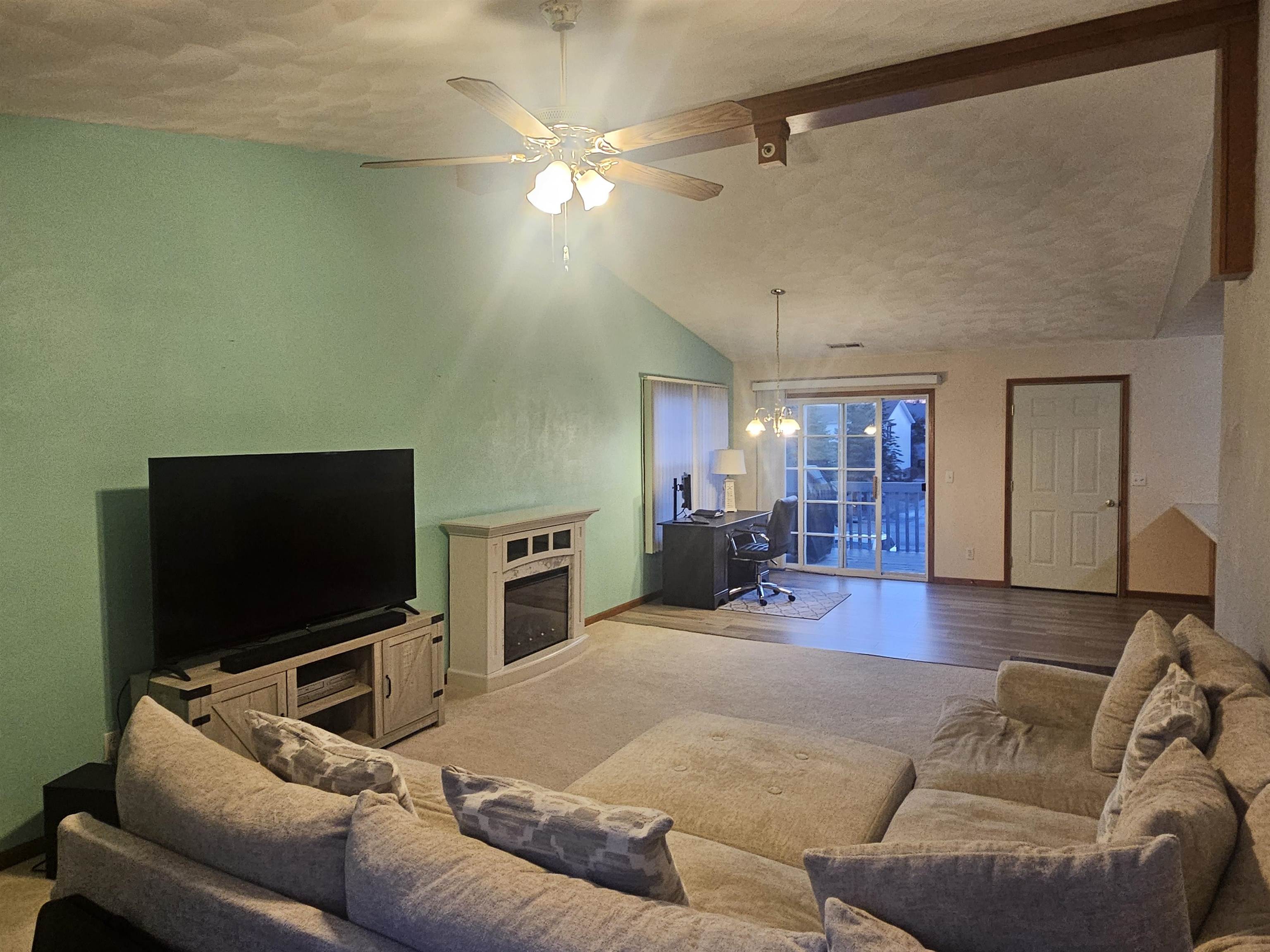 10167 Monarch Road Roscoe, IL 61073 - Photo 6 of 23 a living room with furniture and a flat screen tv