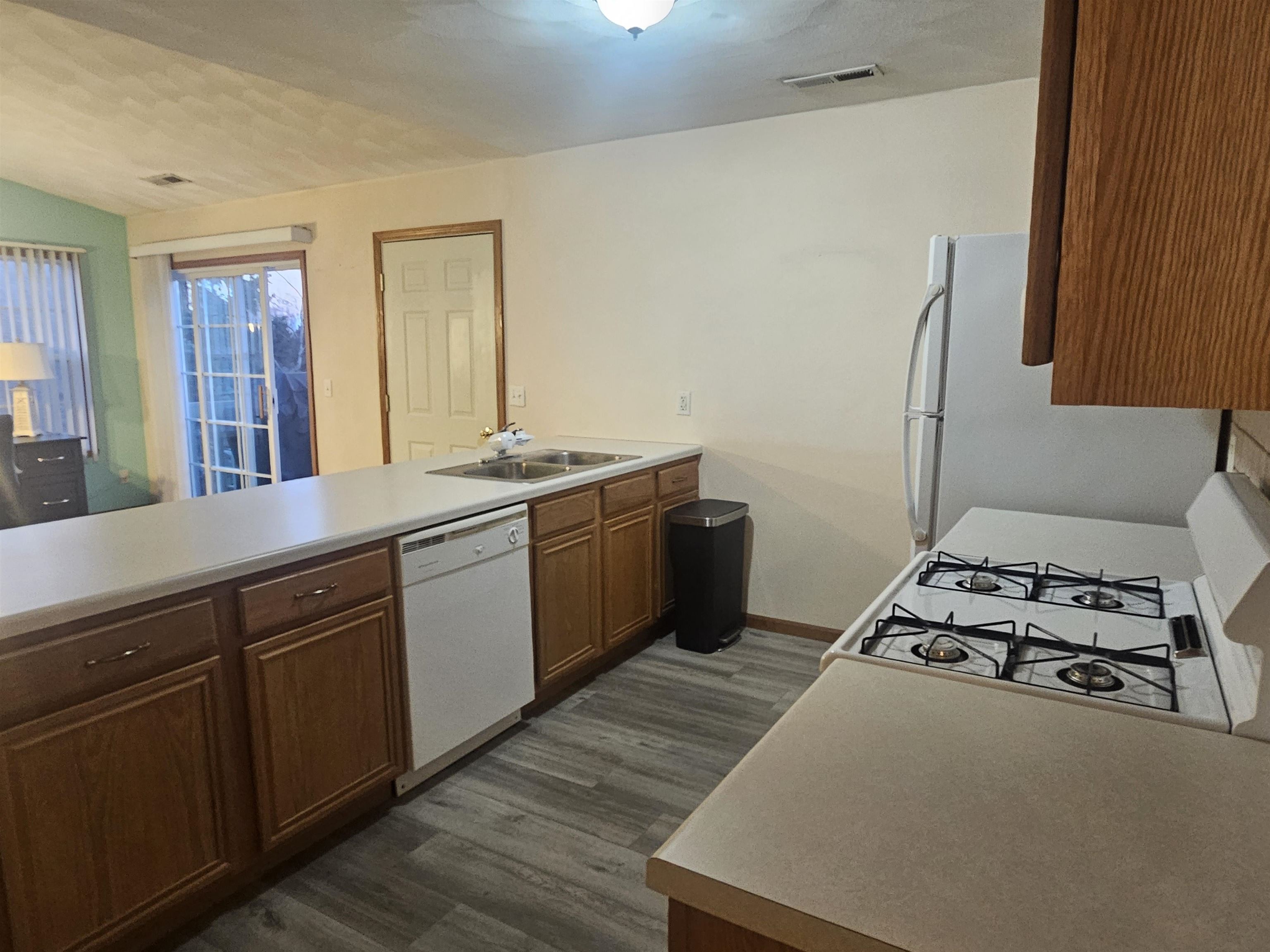 10167 Monarch Road Roscoe, IL 61073 - Photo 10 of 23 a kitchen with stainless steel appliances a sink a stove and a refrigerator