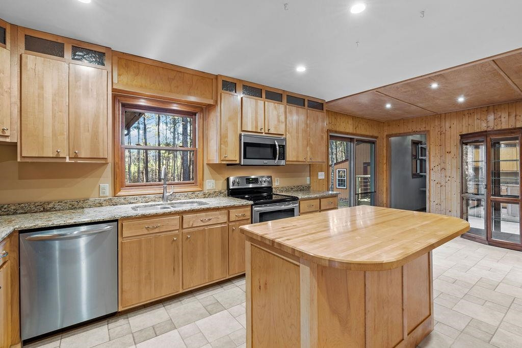 8933 Barker Road New Hill, NC 27562 - Photo 9 of 30 An Abundance of Cabinetry for Loads of Food Storage