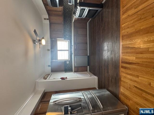 28 Rome Street Newark, NJ 07105 - Photo 7 of 8 a kitchen with a sink wooden floor and stainless steel appliances