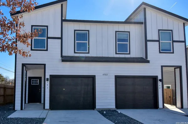 a front view of a house with a garage
