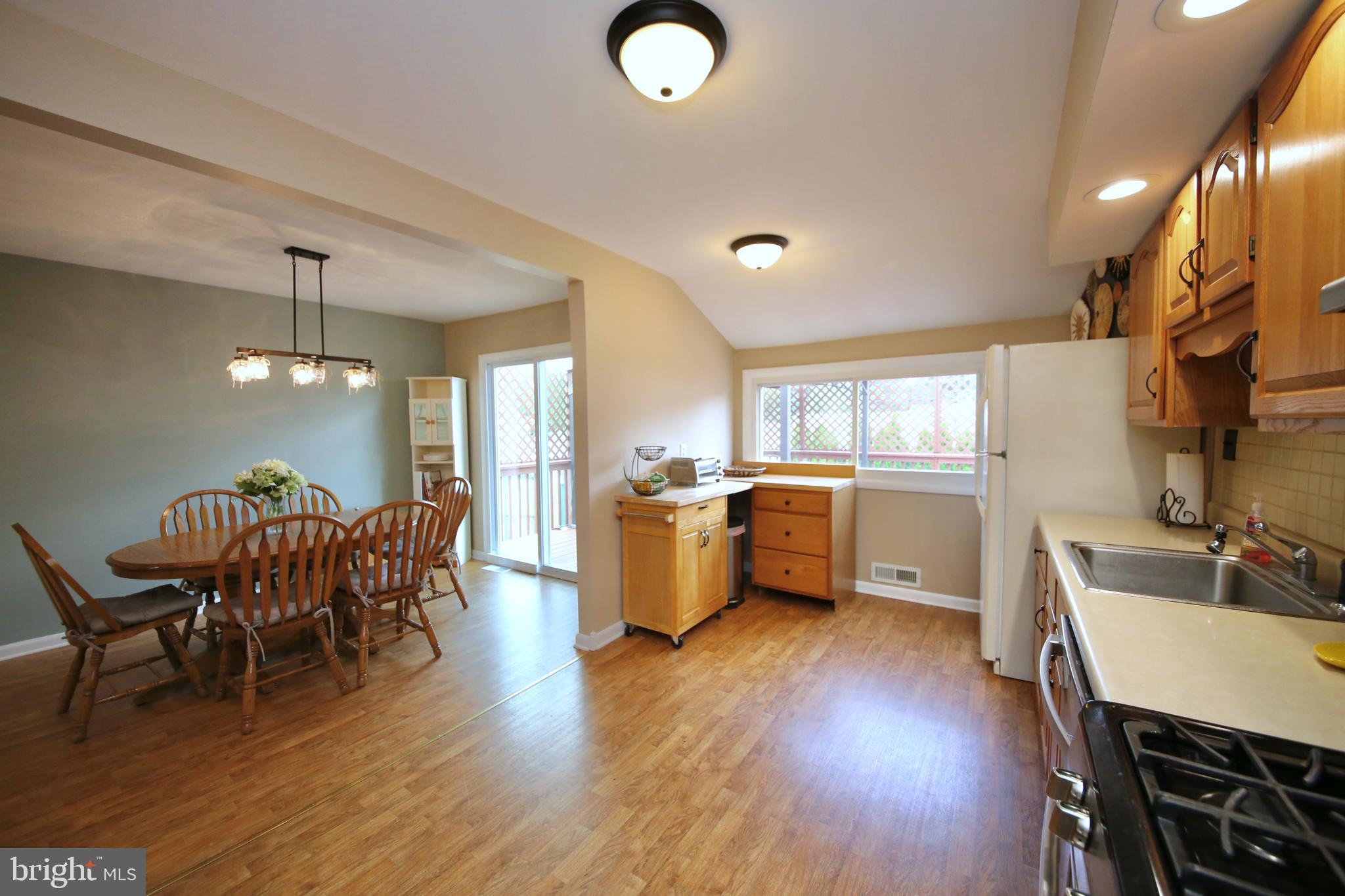 24 Homestead Road Stratford, NJ 08084 - Photo 13 of 39 Laminate flooring in kitchen & dining rooms