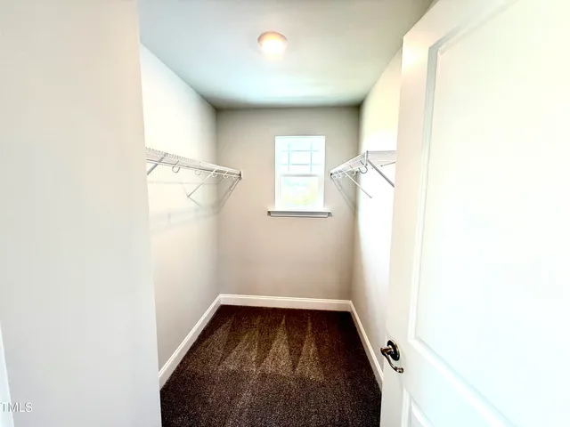 a bathroom with a double vanity sink and mirror