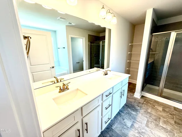 a bathroom with a bathtub and a window