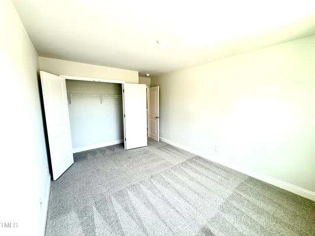 an empty room with a empty space and a window