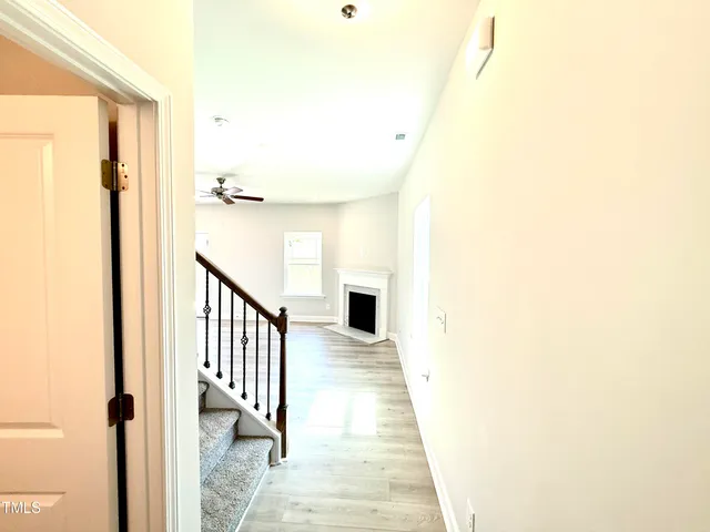 a view of a room with a wooden floor