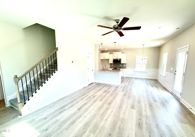 a view of a kitchen with a sink and a fireplace