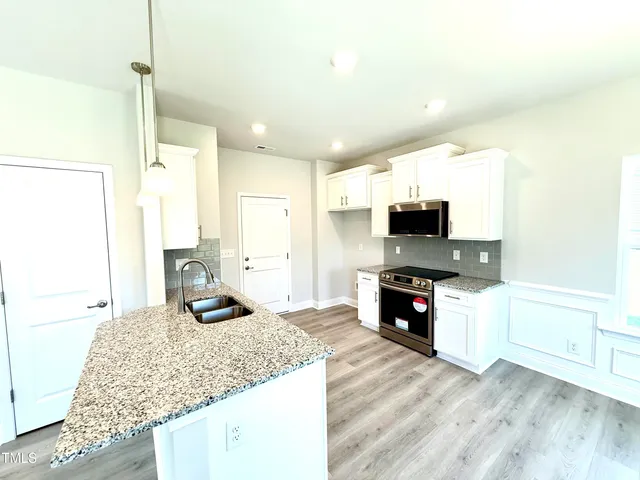 a bathroom with a toilet sink and a mirror