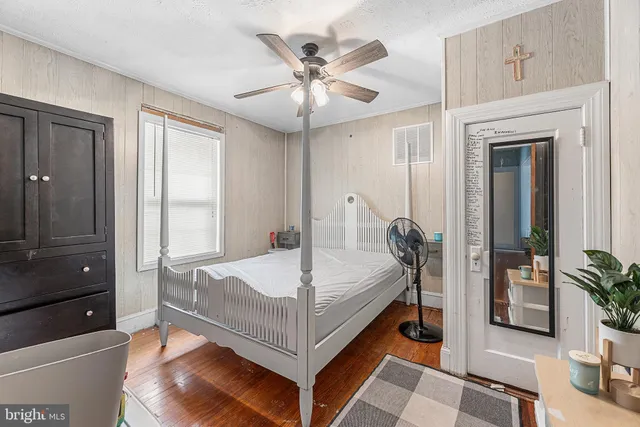 a bed room with a bed and a chandelier