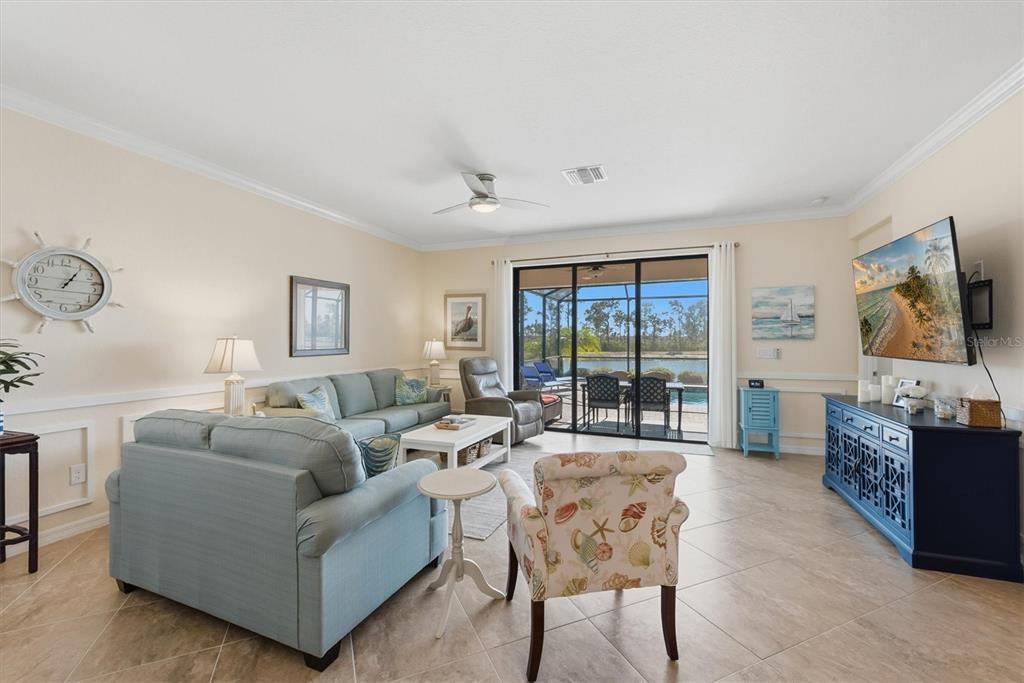 10475 Medjool Drive Venice, FL 34293 - Photo 17 of 71 a living room with furniture and a flat screen tv