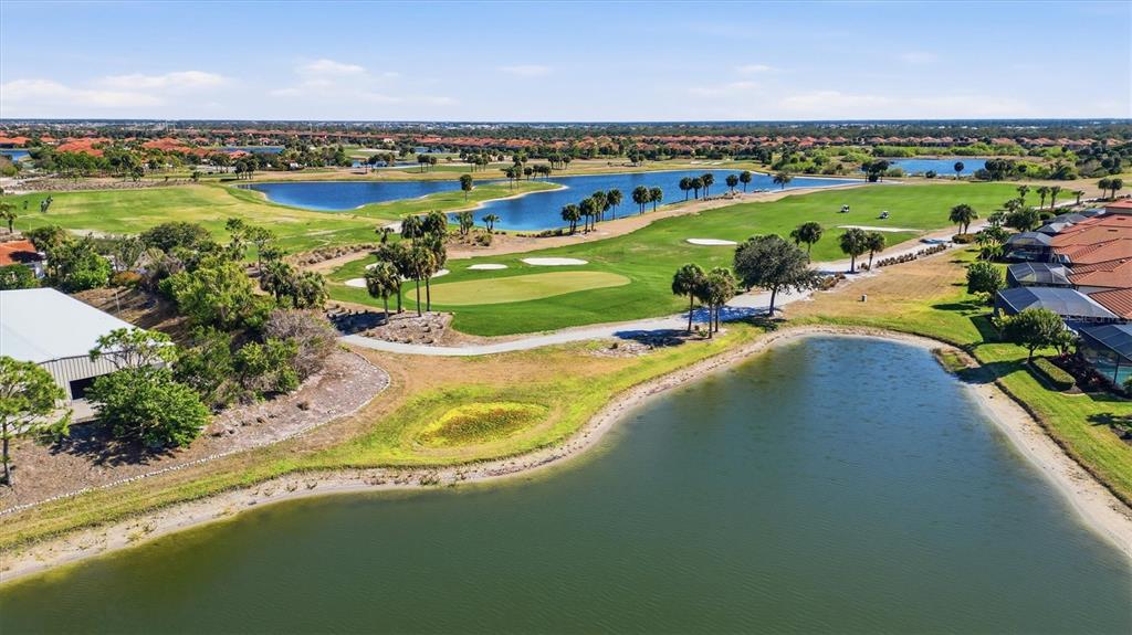 10475 Medjool Drive Venice, FL 34293 - Photo 68 of 71 a view of a city with an ocean beach