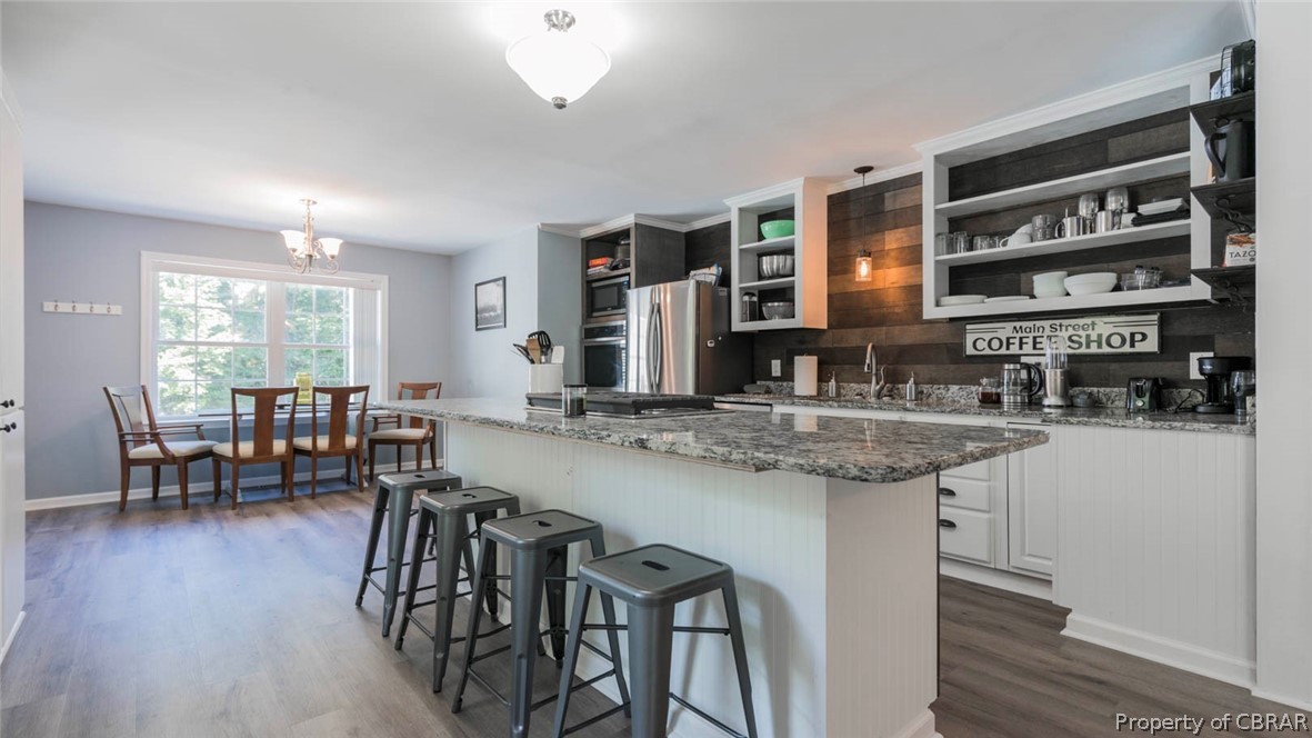 4555 Good Hope Road Lanexa, VA 23089 - Photo 14 of 49 Granite countertops, shiplap backsplash and great counterspace. Time to fall in-love with your updated kitchen.