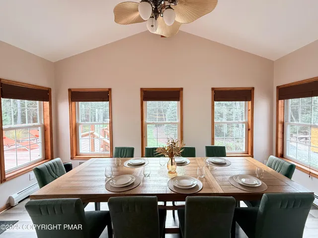 a view of a dining room with furniture window and outside view