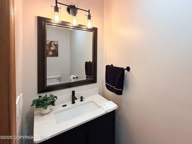 a bathroom with a sink and mirror