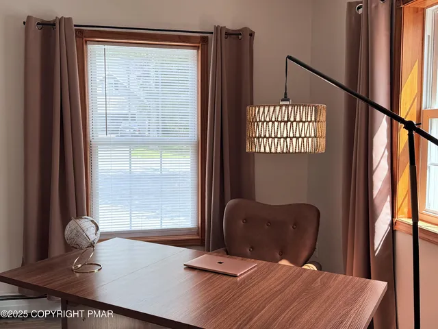 a living room with a couch and a window