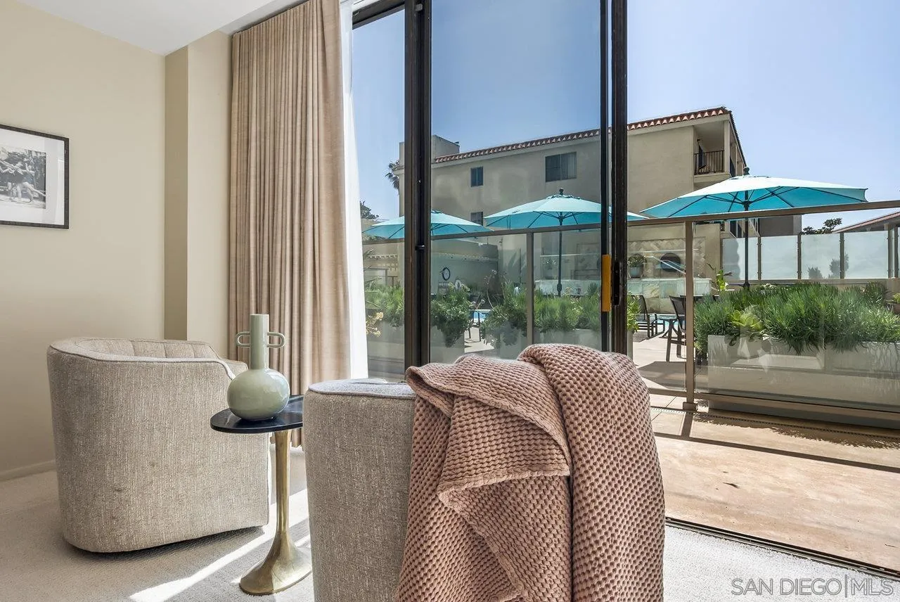 939 Coast Boulevard, Unit 4H La Jolla, CA 92037 - Photo 17 of 39 a balcony with furniture and a large window