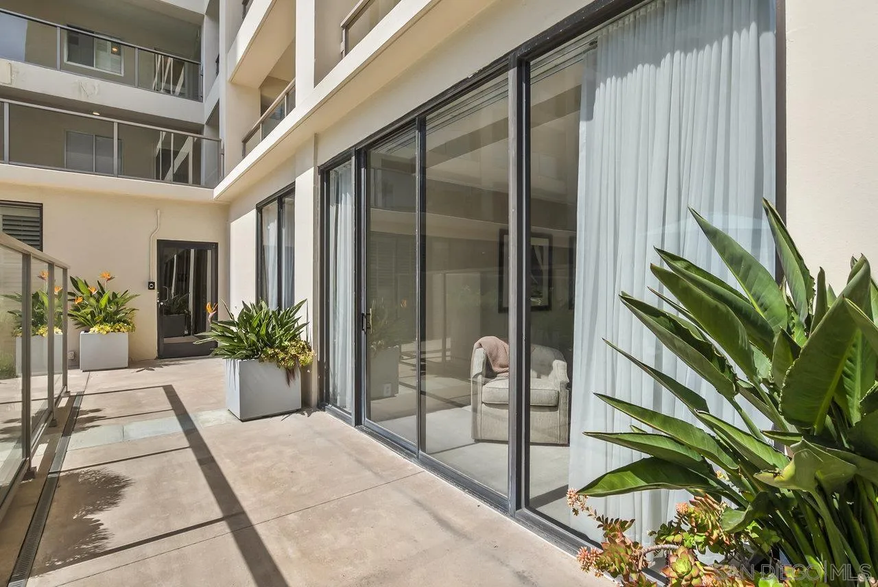 939 Coast Boulevard, Unit 4H La Jolla, CA 92037 - Photo 21 of 39 a potted plant sitting in front of a building
