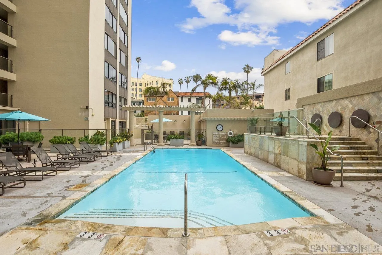 939 Coast Boulevard, Unit 4H La Jolla, CA 92037 - Photo 23 of 39 a view of a swimming pool with outdoor seating