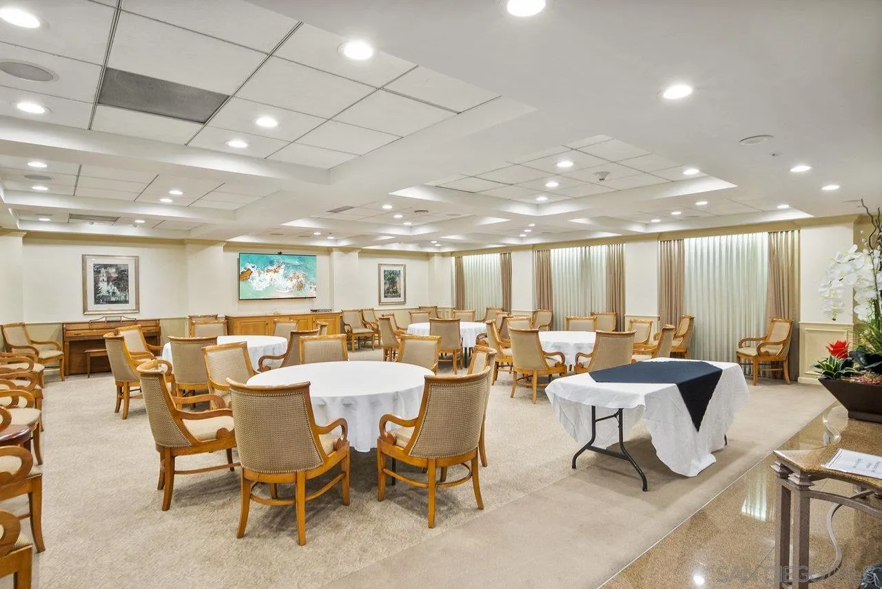 939 Coast Boulevard, Unit 4H La Jolla, CA 92037 - Photo 26 of 39 a living room with lots of furniture and a large window
