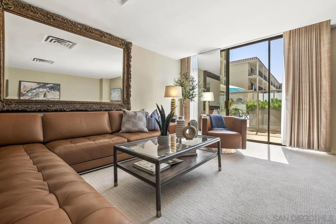 939 Coast Boulevard, Unit 4H La Jolla, CA 92037 - Photo 6 of 39 a living room with furniture and a large window