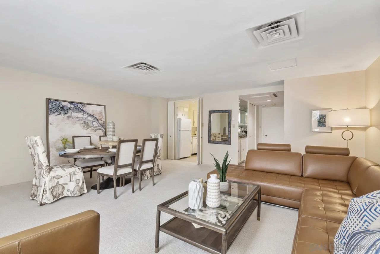 939 Coast Boulevard, Unit 4H La Jolla, CA 92037 - Photo 7 of 39 a living room with furniture and wooden floor