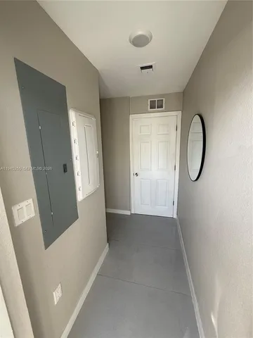 a view of a hallway with windows