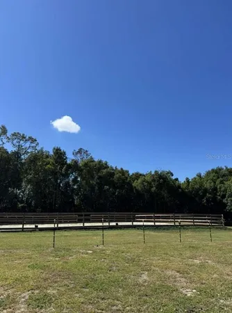 a view of house with small yard