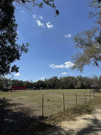 a view of a lake with sunset in background