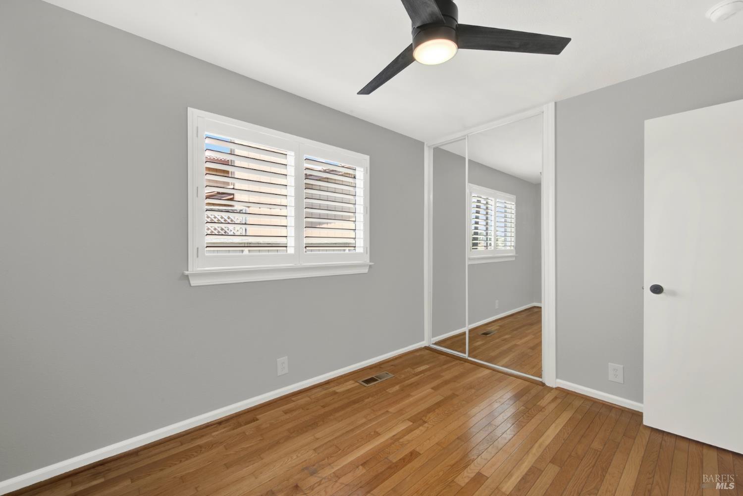 1270 Willow Lake Road Discovery Bay, CA 94505 - Photo 21 of 29 a view of an empty room with wooden floor and a window