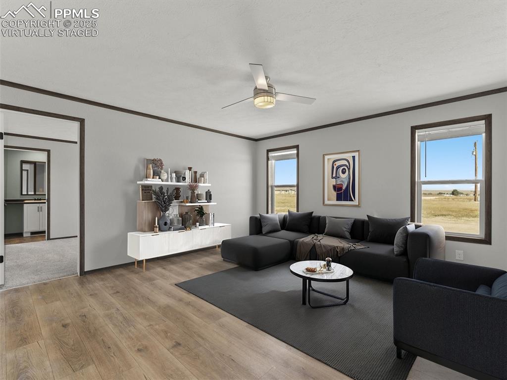 22843 Handle Road Calhan, CO 80808 - Photo 17 of 48 a living room with furniture and a large window
