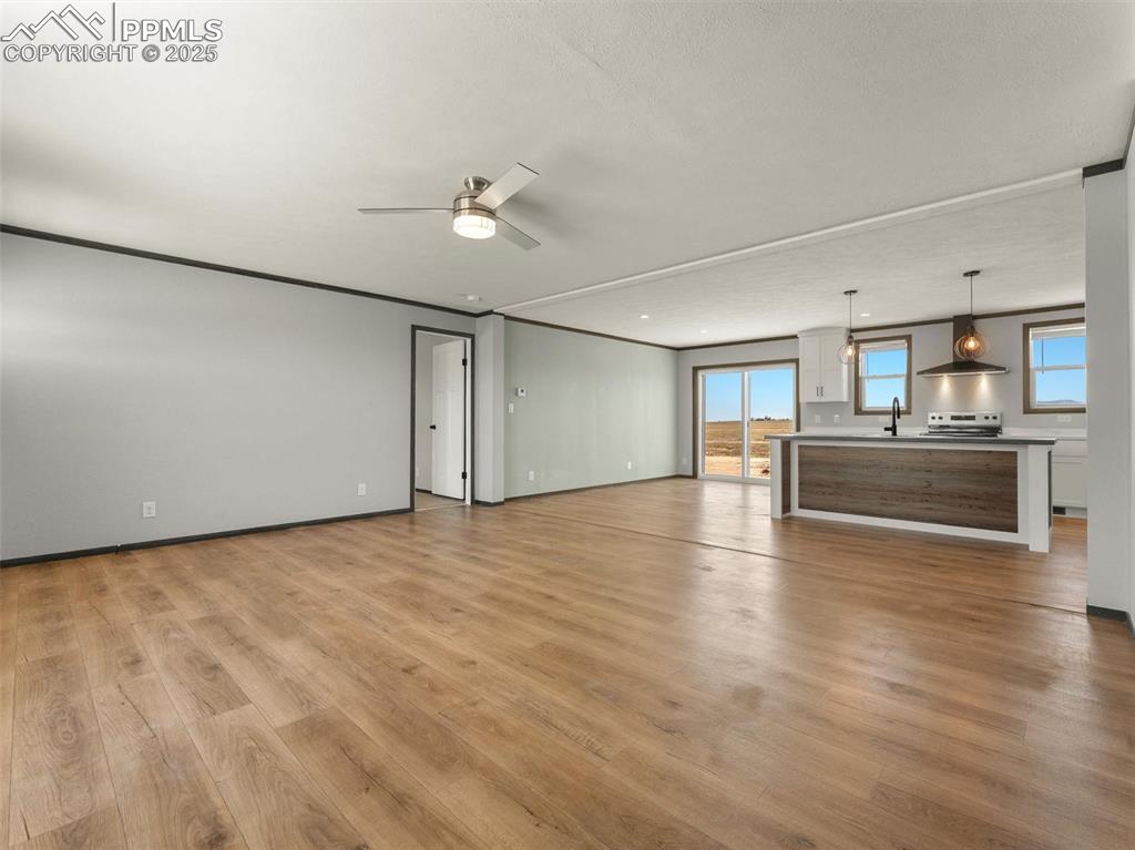 22843 Handle Road Calhan, CO 80808 - Photo 3 of 48 a view of a kitchen with a sink and a refrigerator