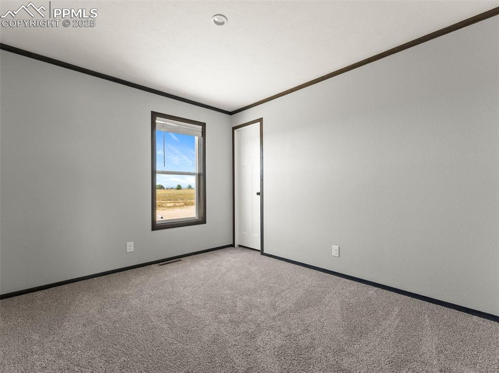 22843 Handle Road Calhan, CO 80808 - Photo 32 of 48 a view of an empty room with a window