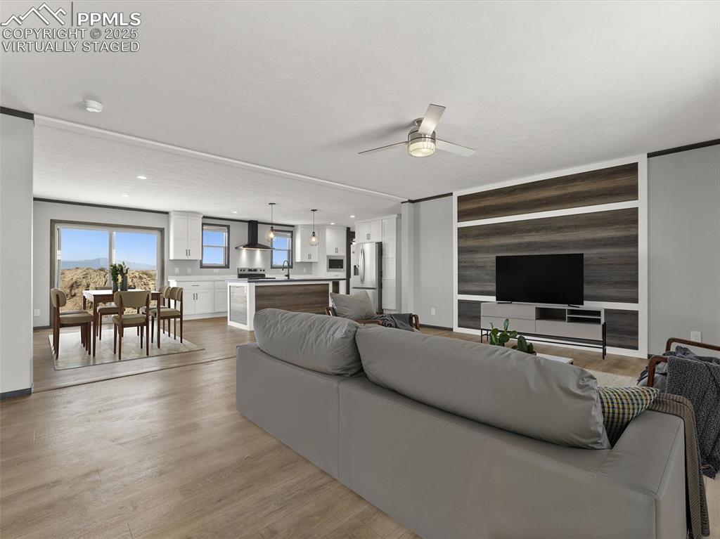 22843 Handle Road Calhan, CO 80808 - Photo 44 of 48 a living room with furniture and a flat screen tv