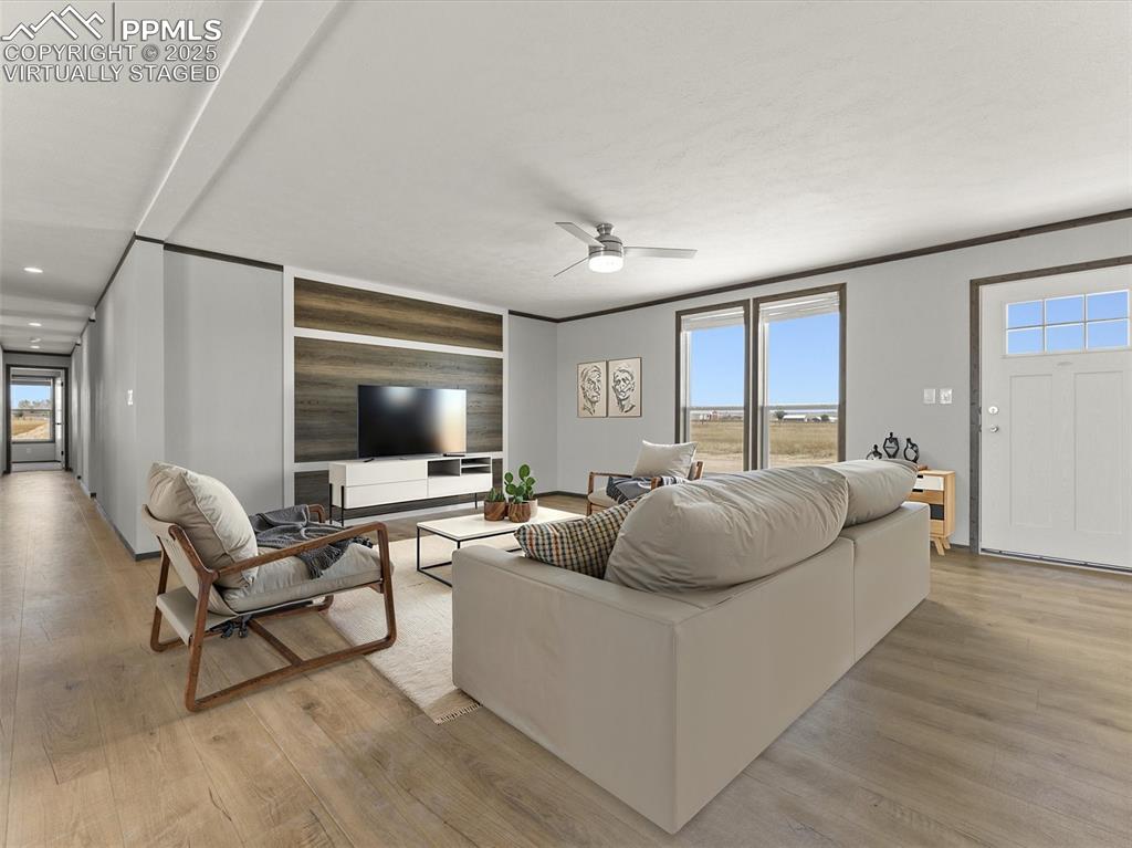 22843 Handle Road Calhan, CO 80808 - Photo 46 of 48 a living room with furniture and a flat screen tv